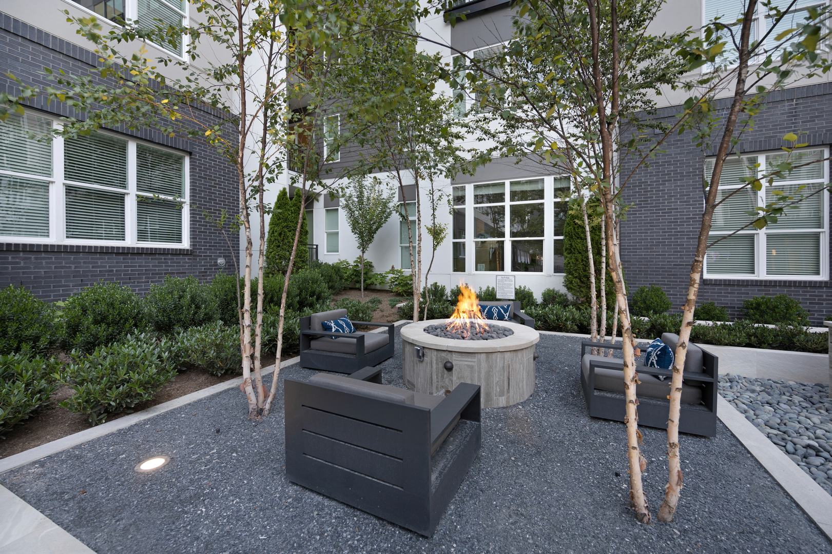 Cozy up by the fire and unwind in our beautifully designed outdoor courtyard, the perfect spot for gathering and relaxation.