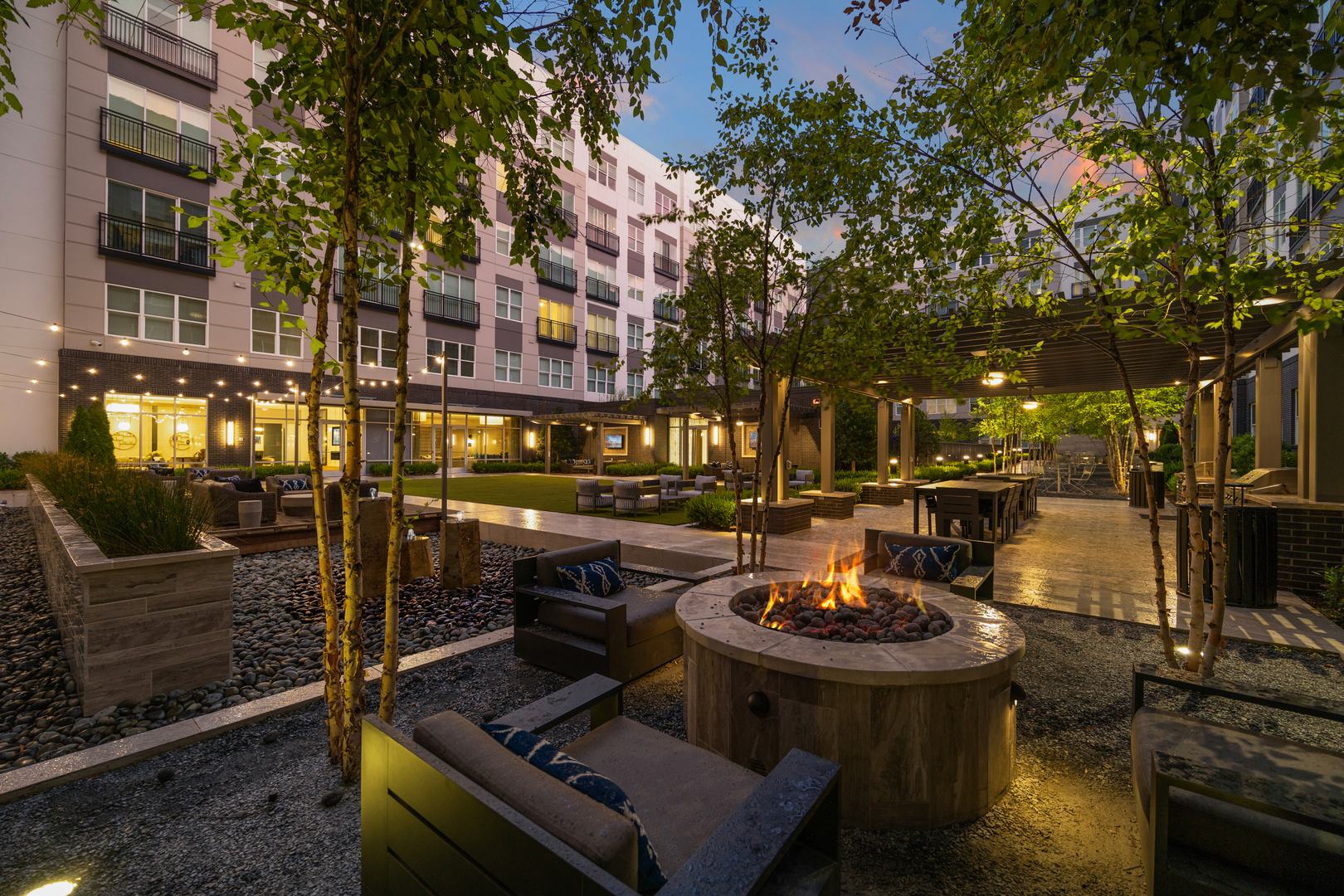 Twilight vibes and fire - lit comfort — experience the perfect outdoor retreat in our spacious courtyard.